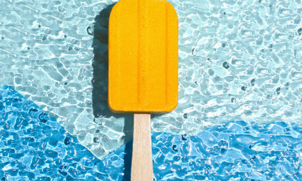 A bath bomb in the shape of an ice cream yellow. Summer concept