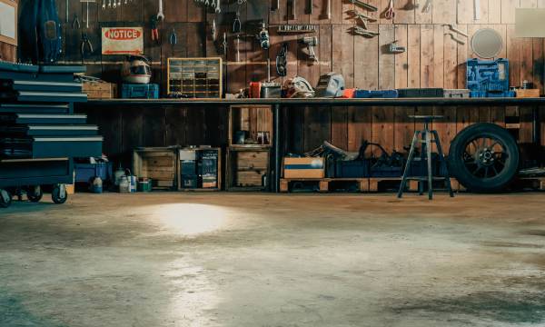 Workshop scene. Old tools hanging on wall in workshop, Tool shel